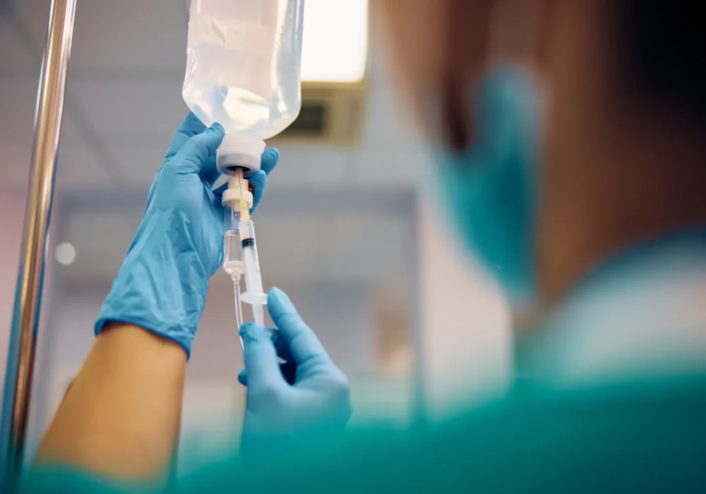 close-up-of-nurse-injecting-medicine-in-patient-s-2023-12-05-15-54-43-utc